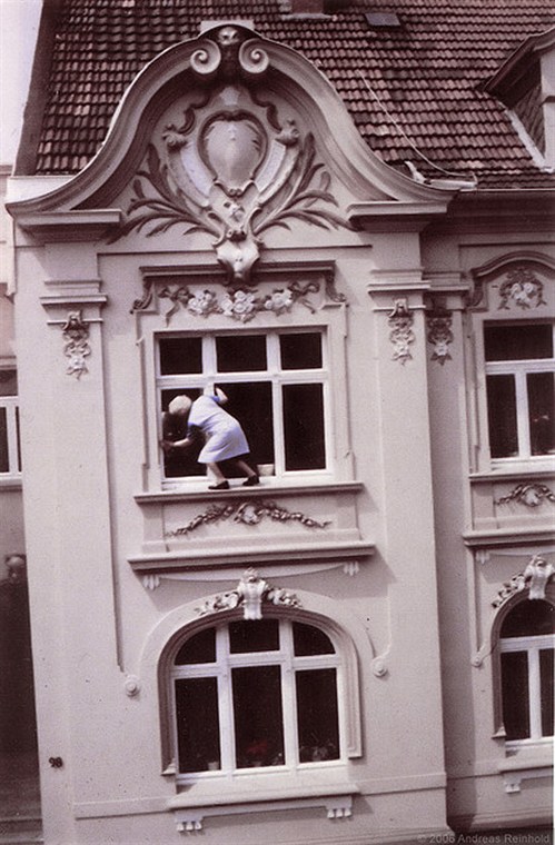 Lady cleaning her outside windows
